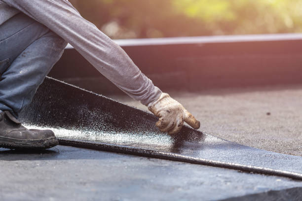 Professional Basement Waterproofing technician working in Mason, TN
